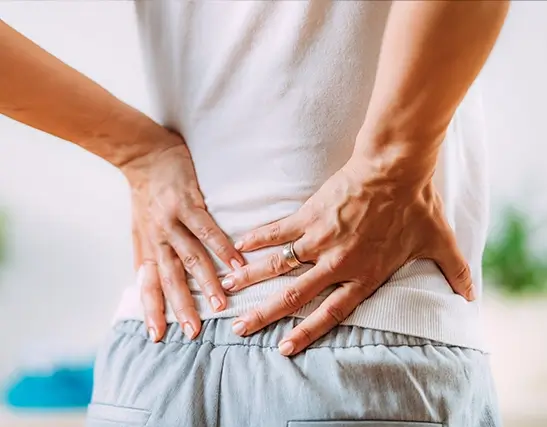 Spine Care Patient Holding Lower Back Spine Care Patient Holding Lower Back
